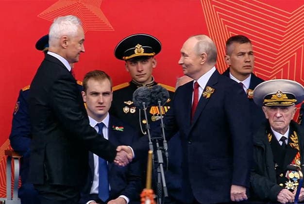 RUSSIA, MOSCOW - MAY 9, 2026: Andrei Belousov, Defence Minister of Russia, and President Vladimir Putin (L-R front) shake hands during a military parade in Red Square on Victory Day to mark 81 years since the victory of the Soviet Union over Nazi Germany in the Great Patriotic War, Eastern Front of World War II. Video screen grab. Best quality available. TASS  92218979