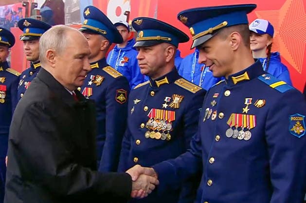 RUSSIA, MOSCOW - MAY 9, 2026: Vladimir Putin (L front), President of Russia, greets service members during a military parade in Red Square on Victory Day to mark 81 years since the victory of the Soviet Union over Nazi Germany in the Great Patriotic War, Eastern Front of World War II. Video screen grab. Best quality available. TASS  92219164