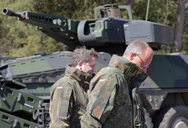 Federal Chancellor Friedrich Merz on the right and Vice Chancellor Lars Klingbeil in camouflage jackets in Munster Federal Chancellor Friedrich Merz on the right and Vice Chancellor Lars Klingbeil in camouflage jackets in Munster Munster Lower Saxony Germany