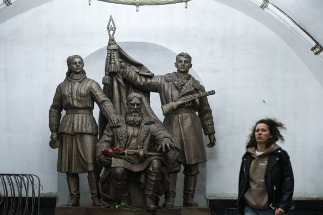 RUSSIA, MOSCOW - MAY 9, 2026: A woman stands by a monument to guerilla warriors at Belorusskaya Station of the Moscow Metro on Victory Day. Mikhail Tereshchenko TASS  92228917