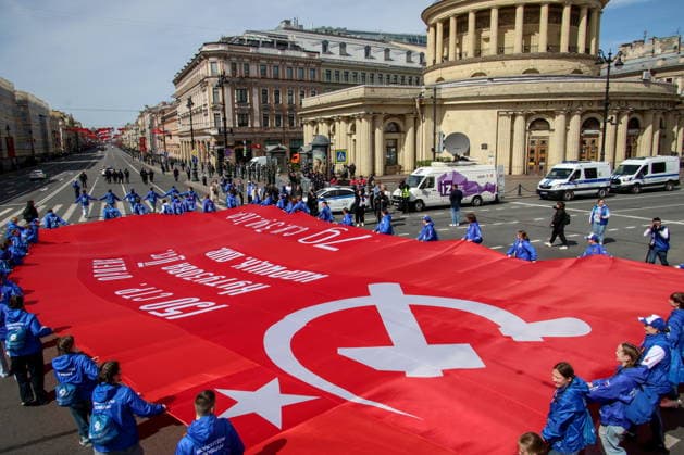 RUSSIA, ST PETERSBURG - MAY 9, 2026: People unfurl a giant copy of the Victory Banner as they take part in an Immortal Regiment event on Victory Day. Peter Kovalev TASS  92225598
