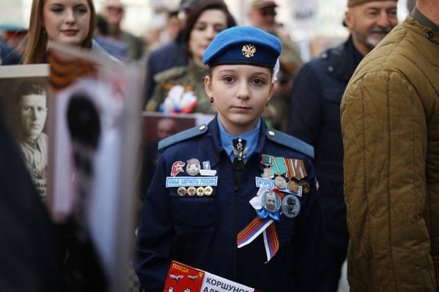 Russia WWII Immortal Regiment Campaign 9161669 09.05.2026 A girl attends the Immortal Regiment march as part of celebrations of the Victory Day, marking the 81st anniversary of the victory over Nazi Germany in World War Two, in St. Petersburg, Russia. Artem Pryahin Sputnik St. Petersburg Russia  Copyright: xArtemxPryahinx
