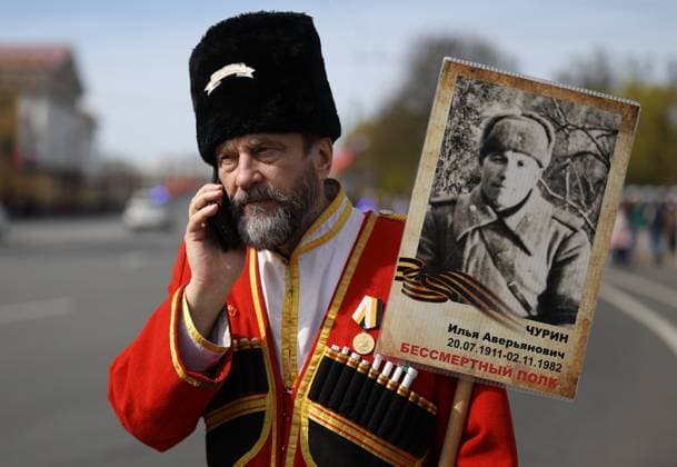 Russia WWII Immortal Regiment Campaign 9161268 09.05.2026 A man dressed as a Cossack attends the Immortal Regiment march as part of celebrations of the Victory Day, marking the 81st anniversary of the victory over Nazi Germany in World War Two, in St. Petersburg, Russia. Artem Pryahin Sputnik St. Petersburg Russia  Copyright: xArtemxPryahinx