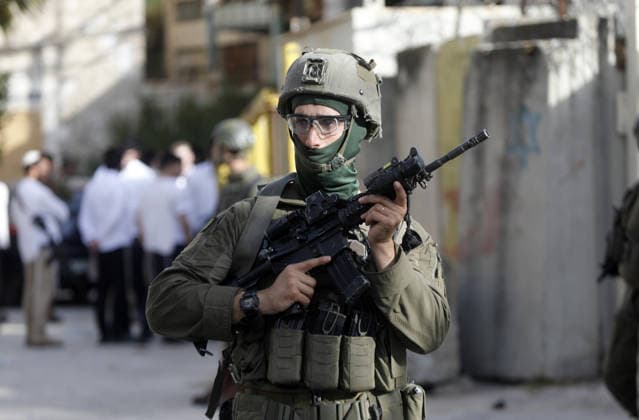 Israeli illegal settlers escorted by security forces raid Hebron s Old City in West Bank WEST BANK, PALESTINE - MAY 09: Israeli settlers raid the Old City of Hebron under the protection of Israeli security forces in the southern West Bank, Palestine on May 09, 2026. Israeli forces implement extensive security measures during the incursion and restrict the movement of Palestinian residents in the area. The presence of armed soldiers ensures the settlers passage through the historic district while local activity remains heavily controlled Mamoun Wazwaz Anadolu West Bank Palestine. Editorial use only. Please get in touch for any other usage.  Copyright: x2026xAnadoluxMamounxWazwazx