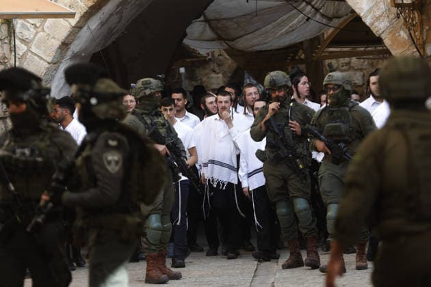 Israeli illegal settlers escorted by security forces raid Hebron s Old City in West Bank WEST BANK, PALESTINE - MAY 09: Israeli settlers raid the Old City of Hebron under the protection of Israeli security forces in the southern West Bank, Palestine on May 09, 2026. Israeli forces implement extensive security measures during the incursion and restrict the movement of Palestinian residents in the area. The presence of armed soldiers ensures the settlers passage through the historic district while local activity remains heavily controlled Mamoun Wazwaz Anadolu West Bank Palestine. Editorial use only. Please get in touch for any other usage.  Copyright: x2026xAnadoluxMamounxWazwazx