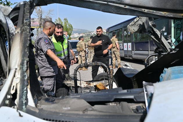 Israeli airstrike targets vehicle on Beirut-Sidon Highway in Lebanon BEIRUT, LEBANON - MAY 09: Lebanese security forces and emergency teams work at the scene after an Israeli air strike targeted a moving vehicle on the Beirut-Sidon highway on May 09, 2026. Reports indicate that two people lost their lives and two others sustained injuries in the attack. The targeted vehicle remains completely destroyed as security personnel cordons off the area following the strike. Houssam Shbaro Anadolu Beirut Lebanon. Editorial use only. Please get in touch for any other usage.  Copyright: x2026xAnadoluxHoussamxShbarox