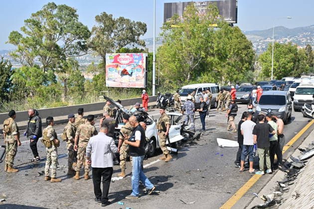 Israeli airstrike targets vehicle on Beirut-Sidon Highway in Lebanon BEIRUT, LEBANON - MAY 09: Lebanese security forces and emergency teams work at the scene after an Israeli air strike targeted a moving vehicle on the Beirut-Sidon highway on May 09, 2026. Reports indicate that two people lost their lives and two others sustained injuries in the attack. The targeted vehicle remains completely destroyed as security personnel cordons off the area following the strike. Houssam Shbaro Anadolu Beirut Lebanon. Editorial use only. Please get in touch for any other usage.  Copyright: x2026xAnadoluxHoussamxShbarox