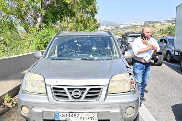 Israeli airstrike targets vehicle on Beirut-Sidon Highway in Lebanon BEIRUT, LEBANON - MAY 09: Lebanese security forces and emergency teams work at the scene after an Israeli air strike targeted a moving vehicle on the Beirut-Sidon highway on May 09, 2026. Reports indicate that two people lost their lives and two others sustained injuries in the attack. The targeted vehicle remains completely destroyed as security personnel cordons off the area following the strike. Houssam Shbaro Anadolu Beirut Lebanon. Editorial use only. Please get in touch for any other usage.  Copyright: x2026xAnadoluxHoussamxShbarox