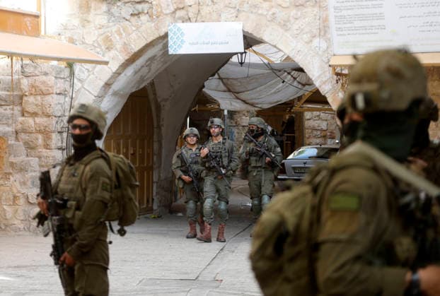Israeli forces escort settlers through Hebron’s Old City Israeli forces patrol the Old City of Hebron in the occupied West Bank on May 09, 2026, during a tour by Israeli settlers through the area’s narrow alleys and old markets. The heavy deployment disrupted commercial activity and restricted the movement of Palestinian residents, as shops closed and streets emptied during the operation. Photo by Mamoun Wazwaz apaimages Hebron West Bank Palestinian Territory 090526_Hebron_MW_00(9) Copyright: xapaimagesxMamounxWazwazx xapaimagesx