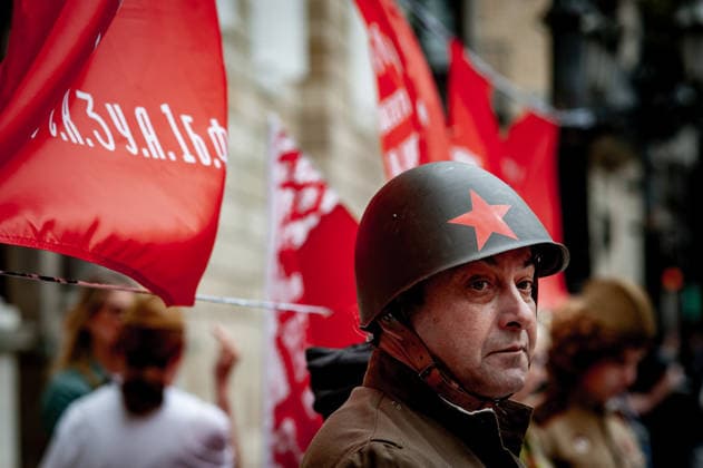 May 9, 2026, Barcelona, Spain: Participant is seen during an Immortal Regiment march in Barcelona where people carry portraits of Soviet soldiers and wave communist flags marking Victory Day, the annual commemoration of the Soviet Union s victory over Nazi Germany in World War II. Barcelona Spain  - ZUMAb137 20260509_fap_b137_006 Copyright: xJordixBoixareux