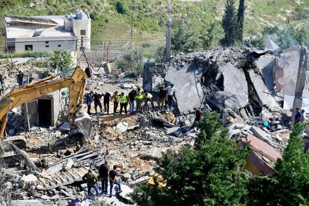 (260510) -- SAKSAKIYEH, May 10, 2026 -- Rescuers search for victims amid the rubble of a residential building after Israeli airstrikes in Saksakiyeh, south Lebanon, May 9, 2026. At least 15 people were killed in a series of Israeli airstrikes in southern Lebanon on Saturday, according to Lebanese official sources. At least one child was among those killed and several children were among those injured in the strikes, according to the Lebanese Health Ministry and the National News Agency. (Photo by Xinhua) LEBANON-SAKSAKIYEH-ISRAELI AIRSTRIKE-AFTERMATH AlixHashisho 