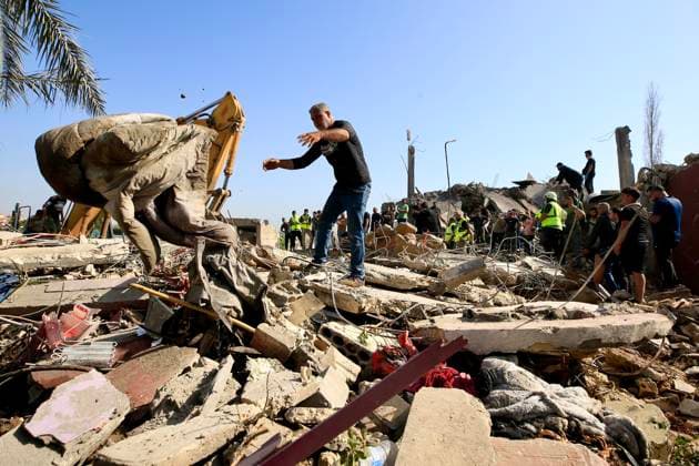 (260510) -- SAKSAKIYEH, May 10, 2026 -- Rescuers search for victims amid the rubble of a residential building after Israeli airstrikes in Saksakiyeh, south Lebanon, May 9, 2026. At least 15 people were killed in a series of Israeli airstrikes in southern Lebanon on Saturday, according to Lebanese official sources. At least one child was among those killed and several children were among those injured in the strikes, according to the Lebanese Health Ministry and the National News Agency. (Photo by Xinhua) LEBANON-SAKSAKIYEH-ISRAELI AIRSTRIKE-AFTERMATH AlixHashisho 