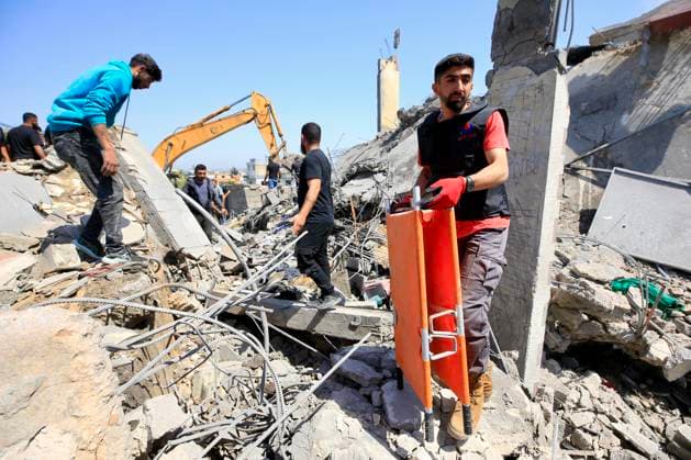 (260510) -- SAKSAKIYEH, May 10, 2026 -- Rescuers search for victims amid the rubble of a residential building after Israeli airstrikes in Saksakiyeh, south Lebanon, May 9, 2026. At least 15 people were killed in a series of Israeli airstrikes in southern Lebanon on Saturday, according to Lebanese official sources. At least one child was among those killed and several children were among those injured in the strikes, according to the Lebanese Health Ministry and the National News Agency. (Photo by Xinhua) LEBANON-SAKSAKIYEH-ISRAELI AIRSTRIKE-AFTERMATH AlixHashisho 