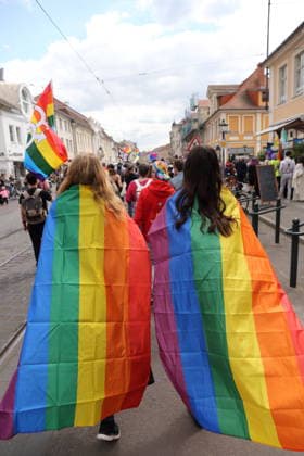 People walk with rainbow flags in Friedrich Ebert Straße during a demonstration for Christopher Street Day in Potsdam, May 9, 2026 CSD in Potsdam