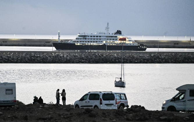 (260510) -- TENERIFE, May 10, 2026 -- Hantavirus-hit cruise ship MV Hondius is seen off the Port of Granadilla on the island of Tenerife in Spain, May 10, 2026. The cruise ship arrived here early Sunday, where Spanish authorities will launch a large-scale operation to evacuate passengers and part of the crew following the deadly outbreak onboard. ) FOCUS Hantavirus-hit ship MV Hondius arrives off Port of Granadilla on Spanish island of Tenerife ChengxMin 