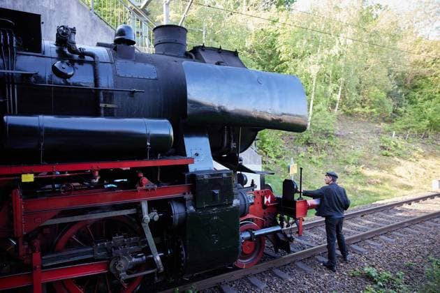 With the steam locomotive through Berlin FOR EDITORIAL PURPOSES ONLY EDITORIAL USE ONLY p Engine driver Alexander Schröder checks his steam locomotive 52 8079 during a stop at Gesundbrunnen stat Copyright: JoergxCarstensen doc85s685nbg2t1lieax83b ,EDITORIAL USE ONLY Copyright: JoergxCarstensen