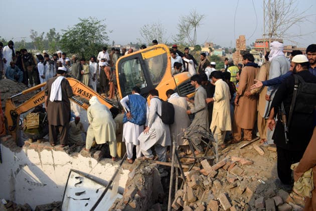 Several killed in car bomb attack at police post in Pakistan BANNU, PAKISTAN, MAY, 10: Pakistani security officials inspect the scene of an overnight car bomb attack at a police post in Bannu, Pakistan, on May 10, 2026. According to police officials, at least 12 police personnel were killed and several others injured after an explosives-laden vehicle struck the checkpoint, followed by an exchange of fire with militants in the northwestern Bannu district bordering Afghanistan. Hussain Ali Anadolu Bannu Pakistan. Editorial use only. Please get in touch for any other usage.  Copyright: x2026xAnadoluxHussainxAlix