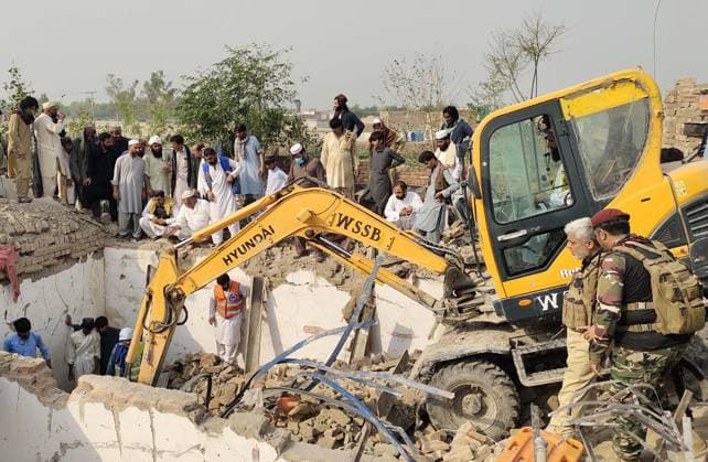 (260510) -- BANNU, May 10, 2026 -- An excavator clears rubble from a police installation destroyed in a suicide attack in Bannu district, Khyber Pakhtunkhwa province, Pakistan, May 10, 2026. At least 12 police personnel were killed and several others injured after a suicide bomber rammed an explosive-laden vehicle into a police installation in Pakistan s northwestern Khyber Pakhtunkhwa province, official sources said on Sunday. (Str Xinhua) (SpotNews) PAKISTAN-BANNU-POLICE INSTALLATION-SUICIDE ATTACK-AFTERMATH AhmadxKamal 