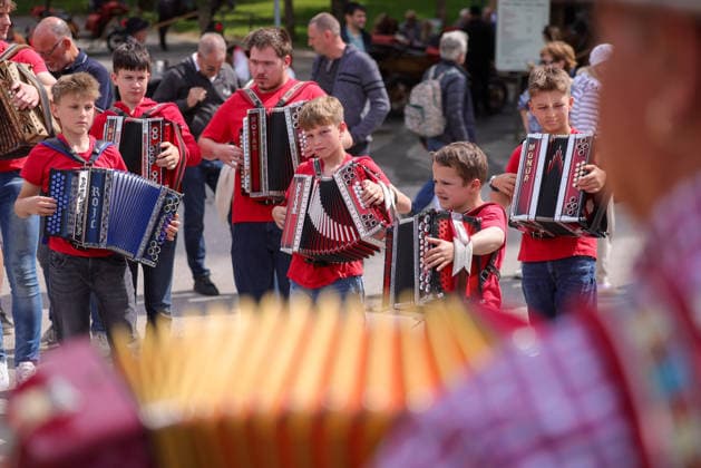 (260510) -- BLED, May 10, 2026 -- Participants play the accordion during the accordion weekend event at Lake Bled in Bled, Slovenia, May 10, 2026. This annual event brings together hundreds of participants for band performances, ensemble shows and an accordion procession. (Photo by Xinhua) SLOVENIA-BLED-ACCORDION WEEKEND ZeljkoxStevanic 