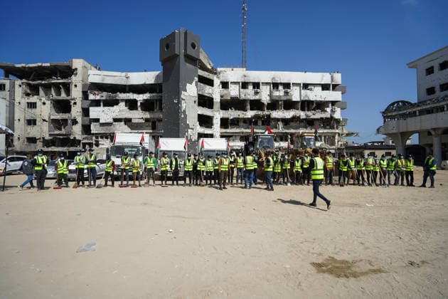 Volunteers clear rubble at al-Shifa Hospital in Gaza City Palestinian volunteers take part in removing rubble and cleaning the outer courtyard of al-Shifa Hospital in Gaza City on May 10, 2026, as part of the Volunteer Work Week activities organized by the Operation Chivalrous Knight 3 initiative. The campaign included cleaning works, rubble removal, tree planting and the installation of shade structures for residents around the hospital. Photo by Ramzi Abu Amer apaimages Khan Yunis Gaza Strip Palestinian Territory 100526_Gaza_RA_00(1).jpeg Copyright: xapaimagesxRamzixxAbuxAmerx xapaimagesx