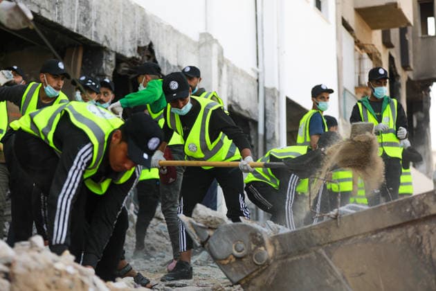 Volunteers clear rubble at al-Shifa Hospital in Gaza City Palestinian volunteers take part in removing rubble and cleaning the outer courtyard of al-Shifa Hospital in Gaza City on May 10, 2026, as part of the Volunteer Work Week activities organized by the Operation Chivalrous Knight 3 initiative. The campaign included cleaning works, rubble removal, tree planting and the installation of shade structures for residents around the hospital. Photo by Ramzi Abu Amer apaimages Khan Yunis Gaza Strip Palestinian Territory 100526_Gaza_RA_00(25).jpeg Copyright: xapaimagesxRamzixxAbuxAmerx xapaimagesx