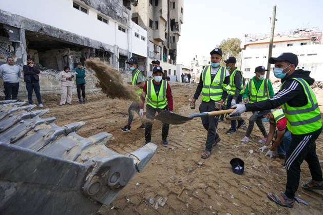 Volunteers clear rubble at al-Shifa Hospital in Gaza City Palestinian volunteers take part in removing rubble and cleaning the outer courtyard of al-Shifa Hospital in Gaza City on May 10, 2026, as part of the Volunteer Work Week activities organized by the Operation Chivalrous Knight 3 initiative. The campaign included cleaning works, rubble removal, tree planting and the installation of shade structures for residents around the hospital. Photo by Ramzi Abu Amer apaimages Khan Yunis Gaza Strip Palestinian Territory 100526_Gaza_RA_00(10).jpeg Copyright: xapaimagesxRamzixxAbuxAmerx xapaimagesx