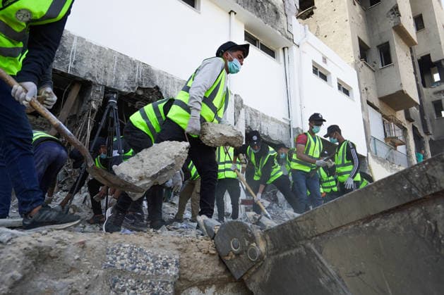 Volunteers clear rubble at al-Shifa Hospital in Gaza City Palestinian volunteers take part in removing rubble and cleaning the outer courtyard of al-Shifa Hospital in Gaza City on May 10, 2026, as part of the Volunteer Work Week activities organized by the Operation Chivalrous Knight 3 initiative. The campaign included cleaning works, rubble removal, tree planting and the installation of shade structures for residents around the hospital. Photo by Ramzi Abu Amer apaimages Khan Yunis Gaza Strip Palestinian Territory 100526_Gaza_RA_00(14).jpeg Copyright: xapaimagesxRamzixxAbuxAmerx xapaimagesx