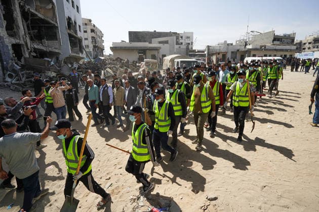 Volunteers clear rubble at al-Shifa Hospital in Gaza City Palestinian volunteers take part in removing rubble and cleaning the outer courtyard of al-Shifa Hospital in Gaza City on May 10, 2026, as part of the Volunteer Work Week activities organized by the Operation Chivalrous Knight 3 initiative. The campaign included cleaning works, rubble removal, tree planting and the installation of shade structures for residents around the hospital. Photo by Ramzi Abu Amer apaimages Khan Yunis Gaza Strip Palestinian Territory 100526_Gaza_RA_00(8).jpeg Copyright: xapaimagesxRamzixxAbuxAmerx xapaimagesx
