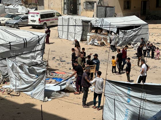 Israeli Strike in Khan Younis May 10 People gather near tents following an Israeli strike opposite the Ihmar Association in the Al-Amal neighbourhood of Khan Younis in the southern Gaza Strip on May 10, 2026. According to Palestinian sources, the strike targeted a Hyundai Tucson vehicle near a junction in the area, killing two people and wounding several others. Khan Yunis Gaza Strip Palestinian Territories Copyright: xDoaaxAlbazx