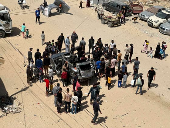 Israeli Strike in Khan Younis May 10 Residents gather around a damaged Hyundai Tucson vehicle following an Israeli strike in the Al-Amal neighbourhood of Khan Younis in the southern Gaza Strip on May 10, 2026. According to Palestinian sources, the strike targeted a Hyundai Tucson vehicle near a junction in the area, killing two people and wounding several others. Khan Yunis Gaza Strip Palestinian Territories Copyright: xDoaaxAlbazx