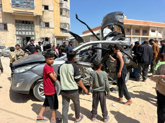 Israeli Strike in Khan Younis May 10 Residents gather around a damaged Hyundai Tucson vehicle following an Israeli strike in the Al-Amal neighbourhood of Khan Younis in the southern Gaza Strip on May 10, 2026. According to Palestinian sources, the strike targeted a Hyundai Tucson vehicle near a junction in the area, killing two people and wounding several others. Khan Yunis Gaza Strip Palestinian Territories Copyright: xDoaaxAlbazx