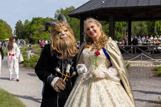 Augsburg, Bavaria, Germany May 10, 2026: Cosplayers dressed as characters from *Beauty and the Beast* at an outdoor event. Elaborate costumes and detailed masks evoke the famous Disney fairy tale film and the international cosplay scene. Traditional Japanese Spring Festival at the Augsburg Botanical Garden. The event is part of the garden™s 90th anniversary celebrations