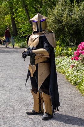 Augsburg, Bavaria, Germany May 10, 2026: A cosplayer in futuristic armor with an illuminated helmet at an outdoor event. The elaborately designed science fiction costume is reminiscent of characters from the worlds of gaming, fantasy, and comics. Traditional Japanese Spring Festival at the Augsburg Botanical Garden. The event is part of the garden™s 90th anniversary celebrations