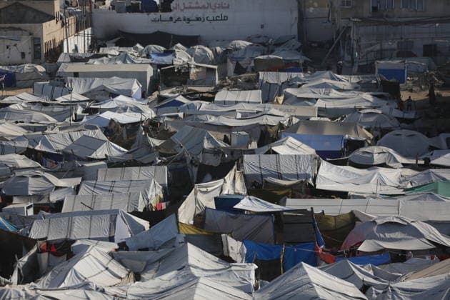 Displaced Palestinians shelter in overcrowded camps west of Gaza City General views show tents sheltering displaced Palestinians crowded together west of Gaza City on May 10, 2026, where thousands of residents live under difficult humanitarian conditions amid shortages of basic services. Many Palestinians continue to flee to densely populated areas across the Gaza Strip as the war continues, while humanitarian organizations warn of worsening living conditions and shortages of food, water and medical care in shelters and displacement camps. Photo by Omar Ashtawy apaimages Gaza city Gaza Strip Palestinian Territory 100526_Gaza_OSH_01(13) Copyright: xapaimagesxOmarxAshtawyx xapaimagesx