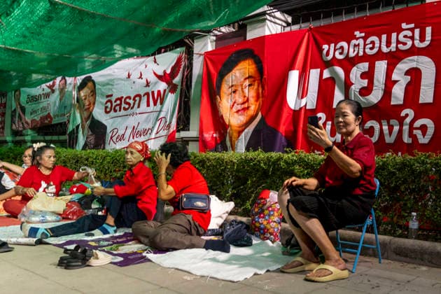 May 10, 2026, Bangkok, Bangkok, Thailand: Supporters of jailed former Prime Minister Thaksin Shinawatra camp outside Klong Prem Central Prison in Bangkok, Thailand, on May 10, 2026, the night before his expected parole release after serving two-thirds of a one-year sentence. Thaksin was convicted on corruption charges in 2023 and sentenced to eight years in prison, later reduced to one year by royal pardon. His case drew renewed controversy after his initial sentence was served almost entirely in a luxury ward at Thailandâ€⠢s Police General Hospital, leading to his subsequent return to prison. Bangkok Thailand - ZUMAt128 20260510_zap_t128_008 Copyright: xAdryelxTalamantesx