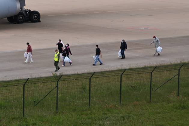 Plane carrying MV Hondius passengers arrives at Eindhoven Airport EINDHOVEN, NETHERLANDS - MAY 10: Passengers walk inside the airport after the plane repatriating 26 Dutch national passengers of the MV Hondius cruise ship, where an outbreak of hantavirus has been detected, lands at Eindhoven Air Base International airport in Eindhoven, Netherlands on May 10, 2026. The World Health Organisation (WHO) has identified six confirmed cases of hantavirus out of eight suspected cases, including three people who have died from this known but rare virus, for which there is neither a vaccine nor a treatment. Mouneb Taim Anadolu Eindhoven Netherlands. Editorial use only. Please get in touch for any other usage.  Copyright: x2026xAnadoluxMounebxTaimx