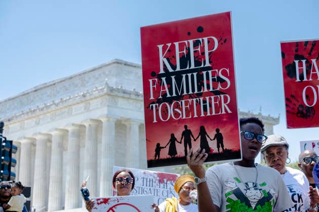May 10, 2026, Washington, Dc, USA: Protesters carry signs for the Black Mothers March near the Lincoln Memorial on MotherÃ¢â‚¬â ¢s Day. Dozens gathered for the rally to demand greater protections for Black mothers and families and reformation of Child Protective Services. Washington USA - ZUMAh204 20260510_znp_h204_008 Copyright: xRileyxHartyx