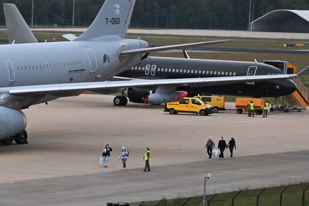 Plane carrying MV Hondius passengers arrives at Eindhoven Airport EINDHOVEN, NETHERLANDS - MAY 10: Passengers walk inside the airport after the plane repatriating 26 Dutch national passengers of the MV Hondius cruise ship, where an outbreak of hantavirus has been detected, lands at Eindhoven Air Base International airport in Eindhoven, Netherlands on May 10, 2026. The World Health Organisation (WHO) has identified six confirmed cases of hantavirus out of eight suspected cases, including three people who have died from this known but rare virus, for which there is neither a vaccine nor a treatment. Mouneb Taim Anadolu Eindhoven Netherlands. Editorial use only. Please get in touch for any other usage.  Copyright: x2026xAnadoluxMounebxTaimx
