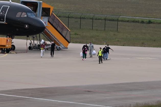 Plane carrying MV Hondius passengers arrives at Eindhoven Airport EINDHOVEN, NETHERLANDS - MAY 10: Passengers walk inside the airport after the plane repatriating 26 Dutch national passengers of the MV Hondius cruise ship, where an outbreak of hantavirus has been detected, lands at Eindhoven Air Base International airport in Eindhoven, Netherlands on May 10, 2026. The World Health Organisation (WHO) has identified six confirmed cases of hantavirus out of eight suspected cases, including three people who have died from this known but rare virus, for which there is neither a vaccine nor a treatment. Mouneb Taim Anadolu Eindhoven Netherlands. Editorial use only. Please get in touch for any other usage.  Copyright: x2026xAnadoluxMounebxTaimx