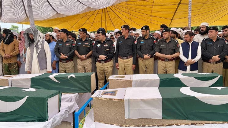 (260511) -- BANNU, May 11, 2026 -- People attend a funeral held for police personnel killed in a suicide bomb attack in Bannu district, Khyber Pakhtunkhwa province, Pakistan, on May 10, 2026. At least 15 police personnel were killed and several others injured after a suicide bomber rammed an explosive-laden vehicle into a police installation in Pakistan s northwestern Khyber Pakhtunkhwa province, official sources said on Sunday. The attack targeted the installation in Bannu district of the province at 8:55 p.m. local time on Saturday (1555 GMT), causing massive destruction to the facility, the sources told Xinhua on condition of anonymity. (Str Xinhua) PAKISTAN-BANNU-SUICIDE ATTACK-POLICE-FUNERAL AhmadxKamal 