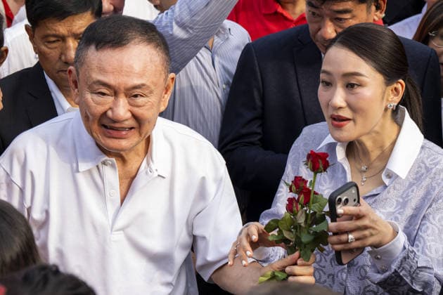 Former Thai Prime Minister Thaksin Shinawatra released on parole BANGKOK, THAILAND - MAY 11: Former Thai Prime Minister Thaksin Shinawatra greets supporters alongside his daughter, Thai Prime Minister Paetongtarn Shinawatra, after exiting Klong Prem Central Prison on parole in Bangkok, Thailand on May 11, 2026. Shinawatra was convicted on corruption charges in 2023 and sentenced to eight years in prison, later reduced to one year by royal pardon. His case drew renewed controversy after he initially served his sentence almost entirely in a luxury ward at Thailand’s Police General Hospital, leading to his subsequent return to prison. Adryel Talamantes Anadolu Bangkok Thailand. Editorial use only. Please get in touch for any other usage.  Copyright: x2026xAnadoluxAdryelxTalamantesx