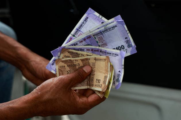 People Refill Petrol And Diesel A driver holds 100 and 10 Rupee notes before refilling fuel at a petrol station in Baramulla, Jammu and Kashmir, India, on May 11, 2026. On Sunday, Prime Minister Narendra Modi urges citizens to reduce fuel consumption, limit foreign travel, and pause gold purchases, citing the economic impact of the war in Iran. Baramulla India  Copyright: xNasirxKachroox originalFilename: kachroo-notitle260511_npgBZ.jpg