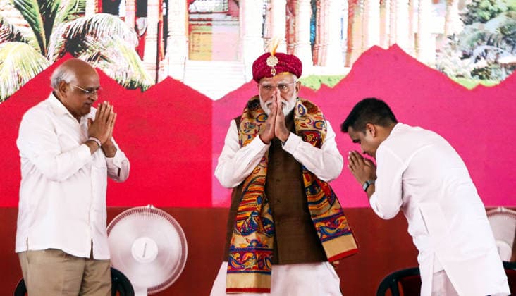 PM Modi attends Public Meeting in Gir Somnath to Mark 75 Years of Somnath Temple Amrut Mahotsav Gir Somnath, May 11 (ANI): Prime Minister Narendra Modi greets as he arrives during a public meeting, celebrating 75 years of the Somnath Temple Amrut Mahotsav, in Gir Somnath on Monday. Gujarat Chief Minister Bhupendra Patel also present. Gir Somnath Gujarat India Copyright: xANIx ANI_20260511233