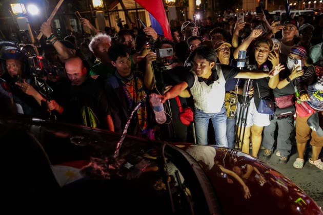 Supporters of former President Duterte protest outside Senate of the Philippines A man douses a car exiting the Philippine Senate with water during a protest against the arrest warrant of former Philippine National Police Chief and current Philippine Senator Ronald dela Rosa at the Philippine Senate in Manila, Philippines on May 11, 2026. The International Criminal Court (ICC) has issued an arrest warrant for the former Philippine National Police Chief Ronald dela Rosa in connection with his role in former Philippine President Rodrigo Duterte s war on drugs. MANILA PHILIPPINES  Copyright: xMatrixxImages MarkxCristinox