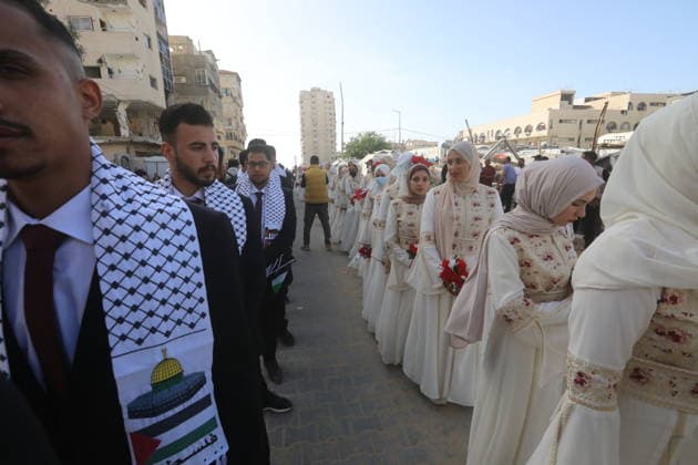 Mass wedding held for Palestinian couples in Gaza City Palestinians take part in a mass wedding ceremony for Palestinian brides and grooms organized by the Turkish Humanitarian Relief Foundation (IHH) in Gaza City on May 11, 2026. The mass wedding was held as part of a humanitarian initiative aimed at supporting 50 grooms who are sons of Palestinians killed during the war, amid difficult humanitarian and economic conditions in the Gaza Strip. Photo by Bilal Osama apaimages Gaza city Gaza Strip Palestinian Territory 110526_Gaza_BO_02(57) Copyright: xapaimagesxBilalxOsamax xapaimagesx