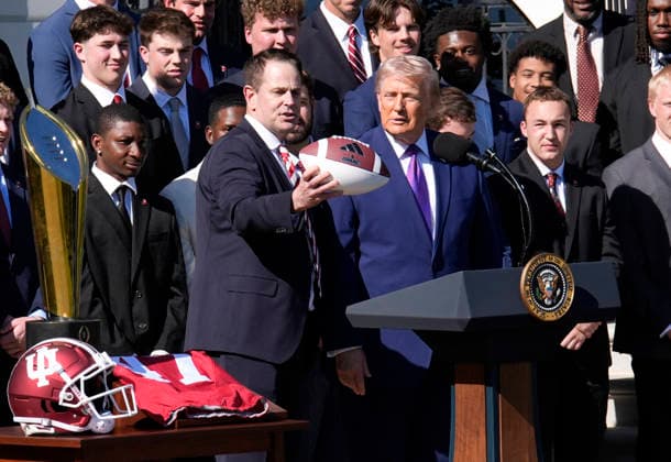 Donald Trump hosts Indiana University Football Champions - Washington Indiana University head football Coach Curt Cignetti gives US President Donald Trump a football as they take part in an event honoring the 2026 College National Football Champions, Indiana University to the White House during a ceremony on the south lawn on May 11, 2026 in Washington, DC. Photo by Yuri Gripas ABACAPRESS.COM Washington DC United States  Copyright: xPool ABACAx