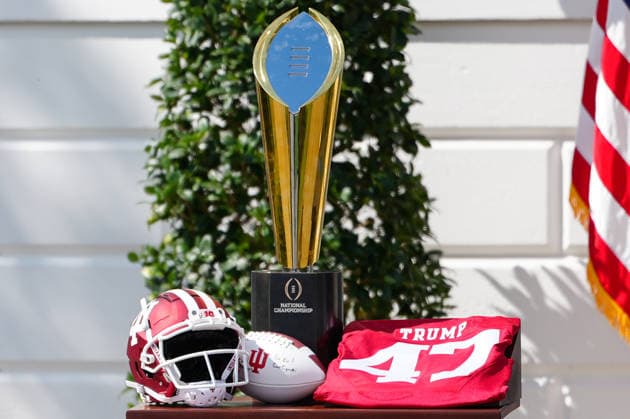 The National Championship trophy and a jersey with President Trump s name sit on a table during an event hosting the 2026 National Football Champions Indiana University on the South Lawn of the White House in Washington DC on Monday, May 11, 2026.  WASP20260511131 AaronxSchwartz