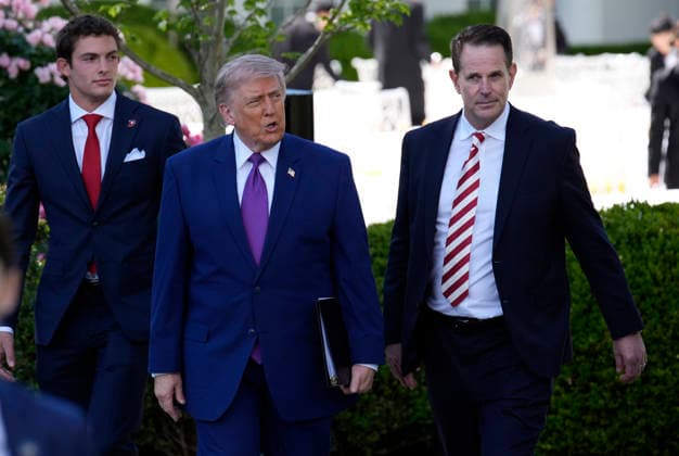 President Donald Trump and Indiana University head football Coach Curt Cignetti arrive for a ceremony on the South Lawn of the White House in Washington, DC on Monday, May 11, 2026.  WASP20260511135 YurixGripas