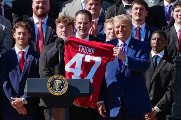 DC: President Trump hosts 2026 National Football Champions Indiana University Indiana University head coach Curt Cignetti gives President Donald Trump a football jersey with Trump 47 written on it at an event hosting the 2026 National Football Champions Indiana University on the South Lawn of The White House in Washington D.C., on Monday, May 11, 2026. (Photo by Aaron Schwartz Pool ABACAPRESS.COM) Washington District of Columbia United States  Copyright: xPool ABACAx