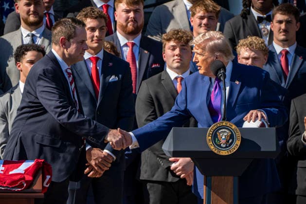 President Donald Trump shakes hands with Indiana University Curt Cignetti during an event welcoming the 2026 College Football National Champions from Indiana University to the White House during a ceremony on the South Lawn in Washington, DC on Monday, May 11, 2026. WAP20260511316 BONNIExCASH